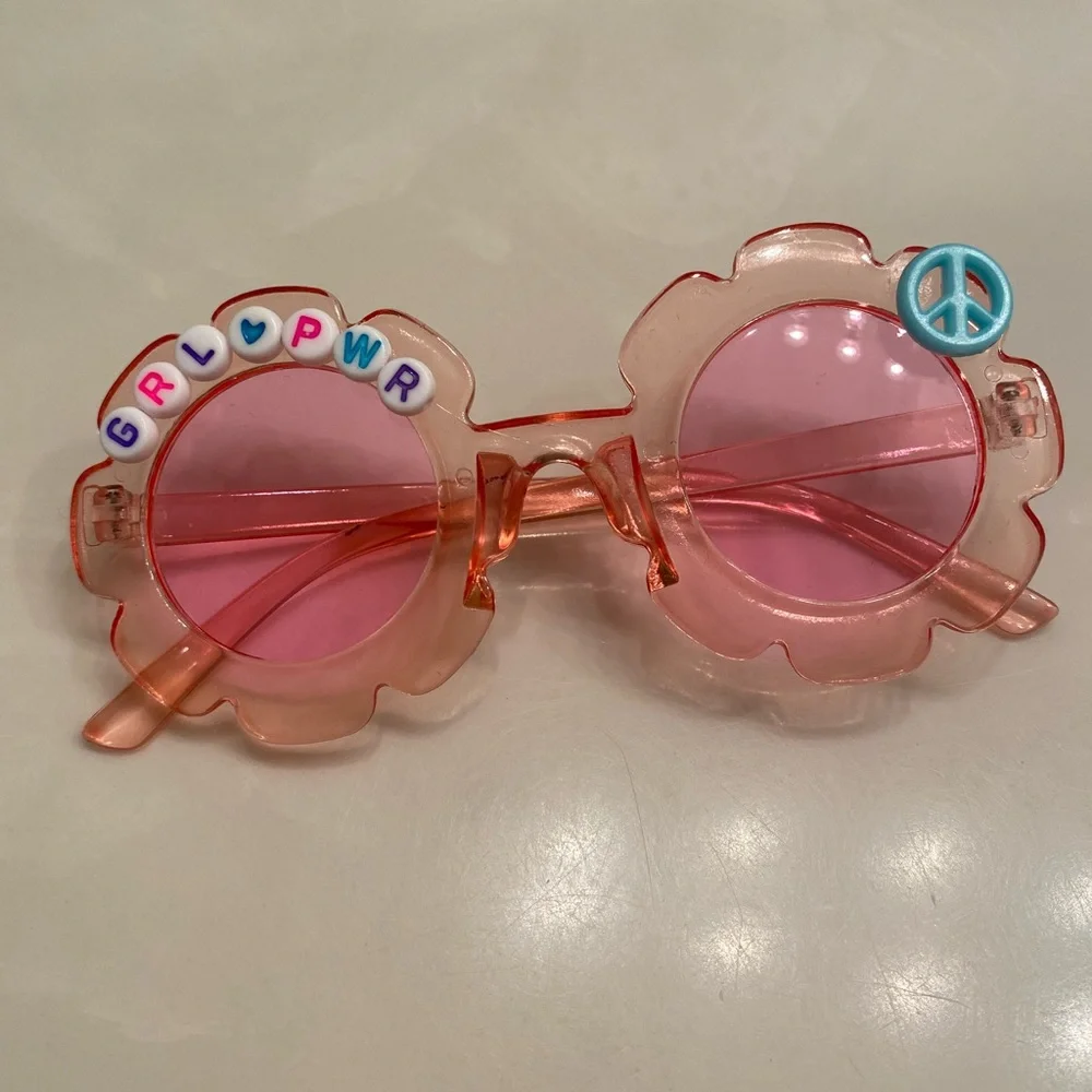 Girls pink see through flower shaped grl pwr sunglasses